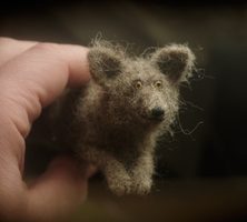 needle felted dog lying down